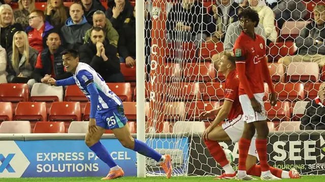 Diego Gomez celebrates after scoring for Brighton at Barnsley in the Carabao Cup third round