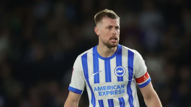 Adam Webster looks on for Brighton
