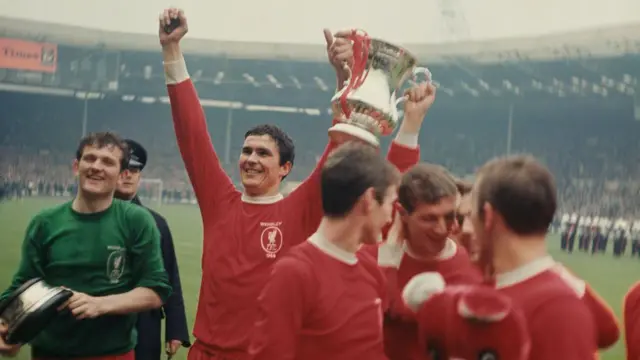 Ron Yeats hold aloft the FA Cup