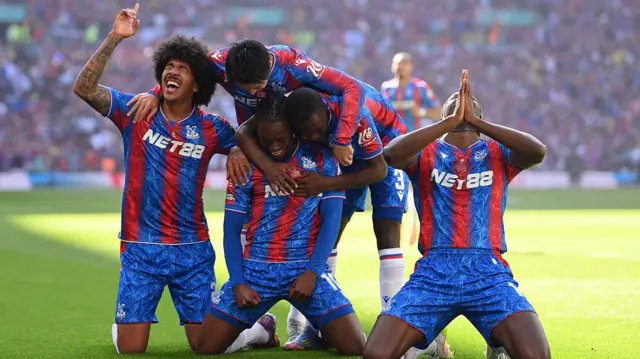 Eberechi Eze celebrating with team-mates