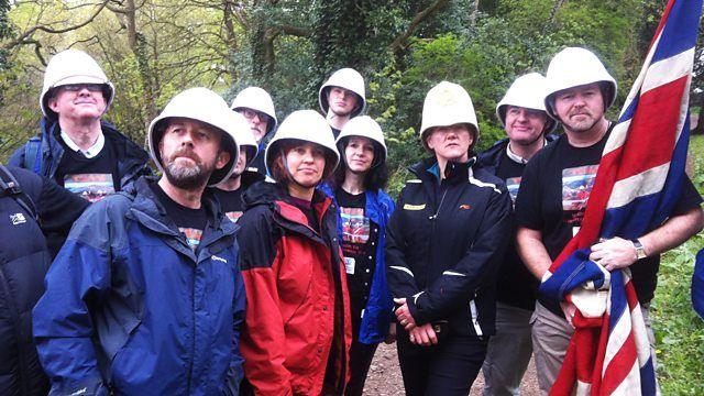 Clare Balding with a group of walkers all in white helmets