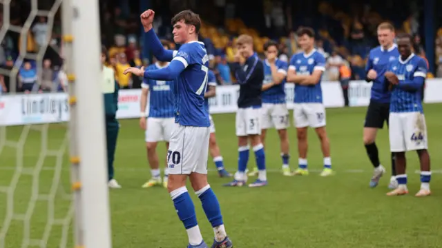 Noah Williams celebrates in front of Cardiff City fans