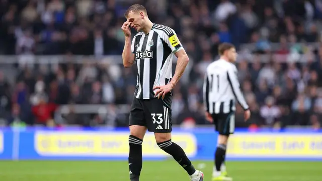  Dan Burn of Newcastle United looks dejected after losing to Everton.