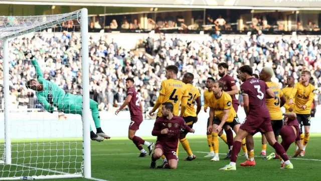 John Stones scores the team's second goal during the English Premier League football match between Wolverhampton Wanderers and Manchester City at the Molineux stadium