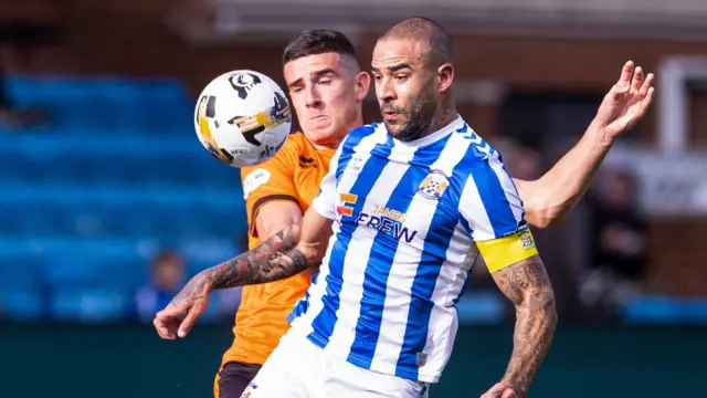 Dundee United's Ross Graham and Kilmarnock's Kyle Vassell