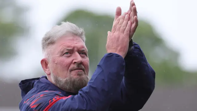 Portadown manager Niall Currie applauds the fans after Saturday's defeat by Glentoran