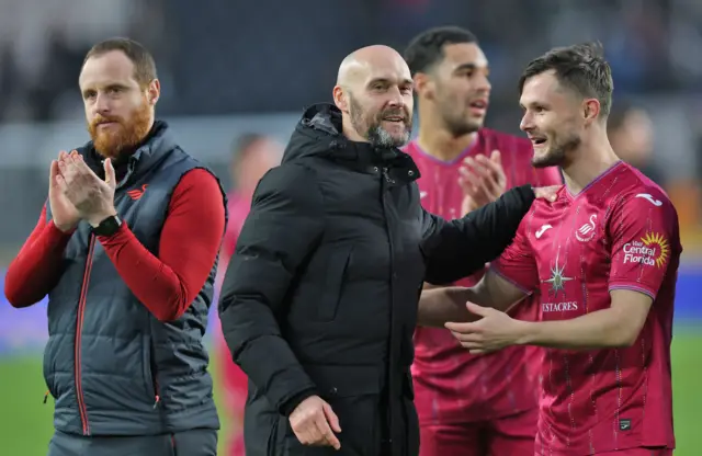 Luke Williams celebrates victory at Hull with Liam Cullen and assistant coach Ryan Harley