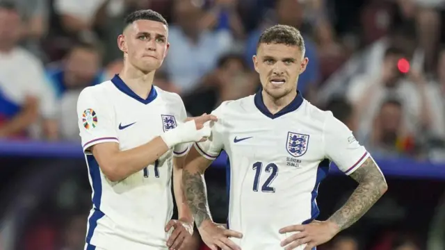 Phil Foden and Kieran Trippier look on for England