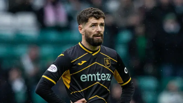 Jamie Brandon looks dejected at full-time at Celtic Park