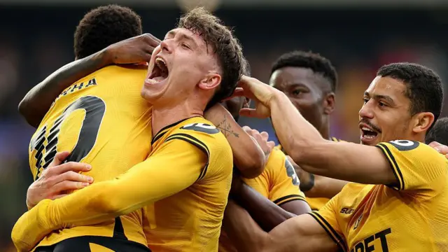 Wolves players celebrate a goal