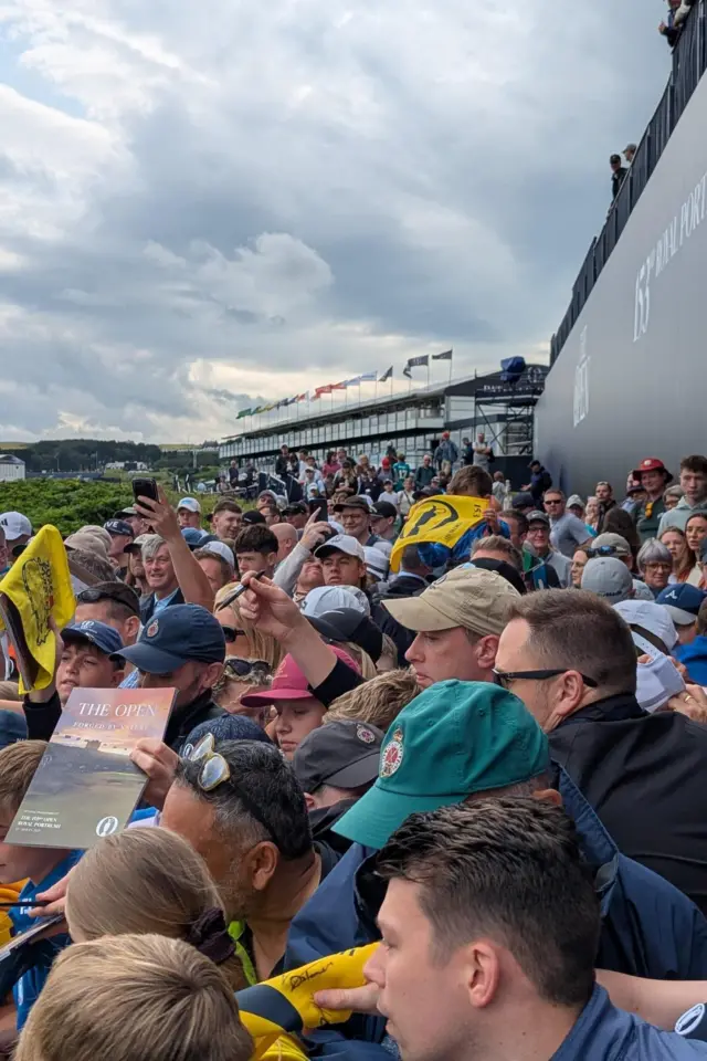 Fans wait for Rory McIlroy's autograph