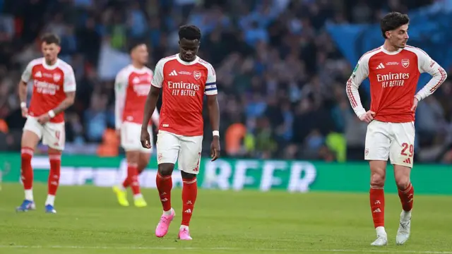 A dejected looking Bukayo Saka and Kai Havertz of Arsenal