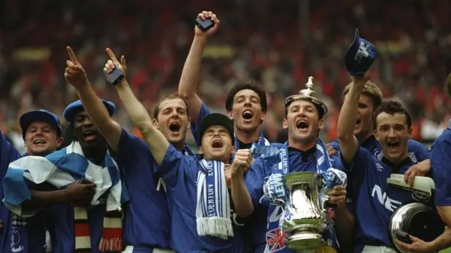 Everton captain Dave Watson holds the FA Cup after the win against Manchester United at Wembley on 20 May 1995