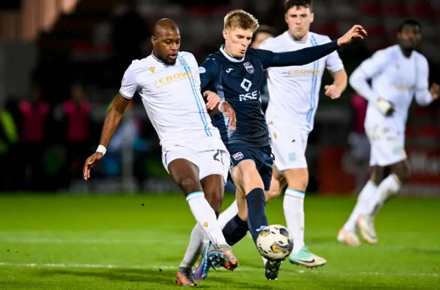 Dundee's Mo Sylla (L) and Ross County's Max Sheaf in action during a cinch Premiership match between Ross County and Dundee