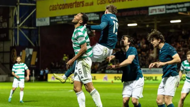 Nicholson battles Auston Trusty in the air