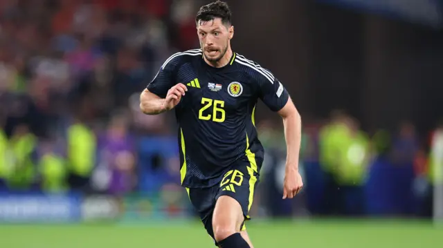 Scott McKenna in action for Scotland