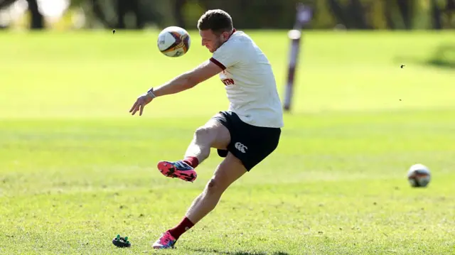 Finn Russell practising his kicking during training