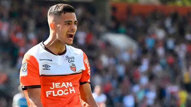 Lorient's French midfielder #10 Romain Faivre celebrates scoring his team's second goal during the French L1 football match between FC Lorient and AS Monaco