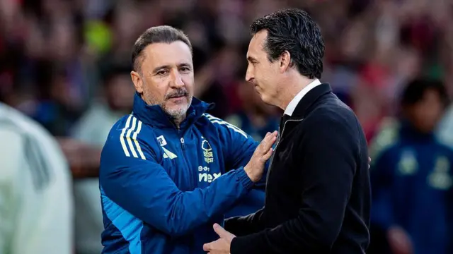 Unai Emery is greeted by Vitor Pereira