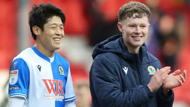 Blackburn's Yuki Ohashi and Matty Litherland look happy as they applaud fans after the 2-0 win over Millwall at Ewood Park 