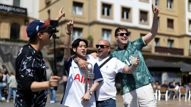 A group of four Tottenham fans chanting