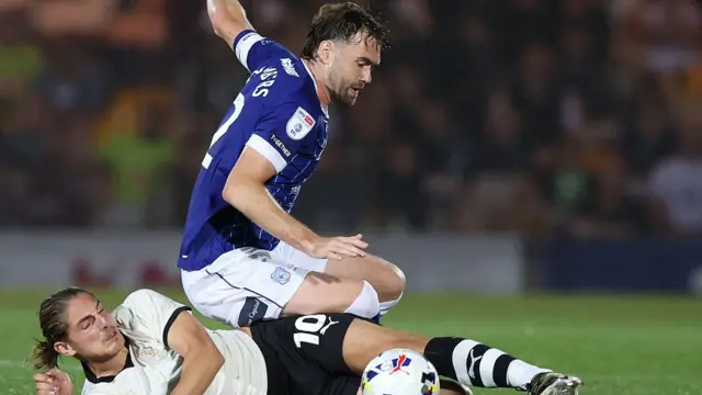 Cardiff City's Calum Chambers tackling Port Vale's Lorent Tolaj