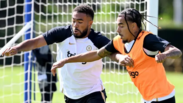 Reece James and Malo Gusto battle for the ball during Chelsea training