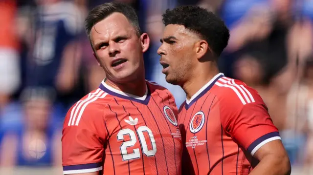 Scotland's Lawrence Shankland and Che Adams celebrate