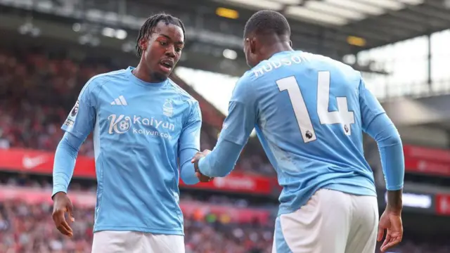 Anthony Elanga and Callum Hudson-Ooi celebrate after a goal against Liverpool