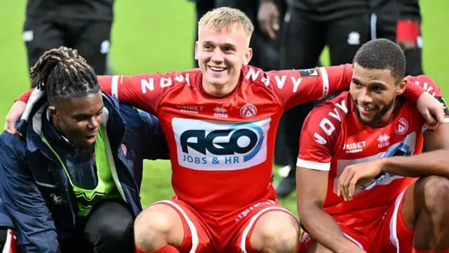 Alex Mighten , Isaak Davies and Mark Mampassi of Kortrijk