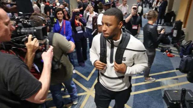 Saquon Barkley walking through the Philadelphia Eagles hotel after a media opportunity before Super Bowl 59