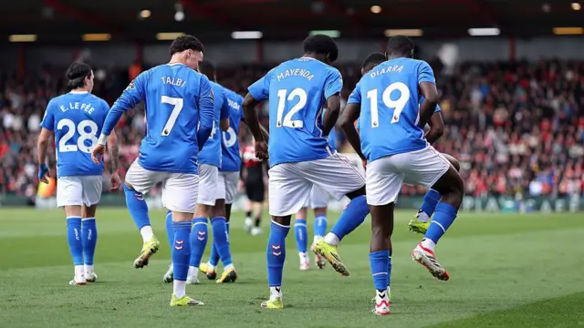 Eliezer Mayenda celebrates scoring his team's first goal with teammates Chemsdine Talbi and Habib Diarra