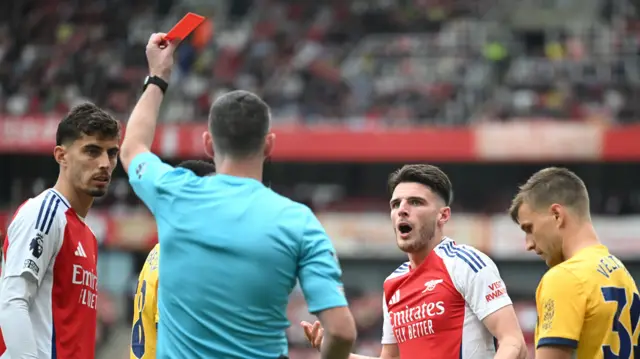 Declan Rice looks shocked after being sent off during Arsenal's home game against Brighton