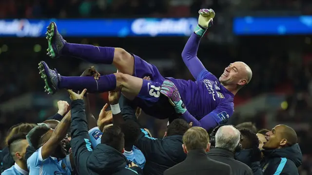 Willy Caballero of Manchester City celebrates victory with his team mates after the penalty shoot out