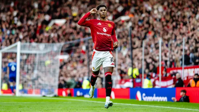 Marcus Rashford of Manchester United celebrates scoring his teams third goal during the Premier League match between Manchester United FC and Everton FC at Old Trafford