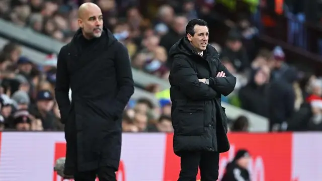 Pep Guardiola and Unai Emery on the touchline during a game between Manchester City and Aston Villa