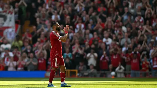 Mohamed Salah applauds the fans as he leaves the pitch i