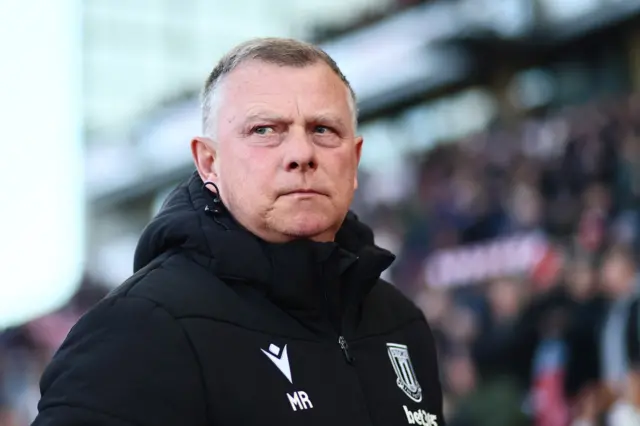 Mark Robins looks stern on the Stoke City sideline 