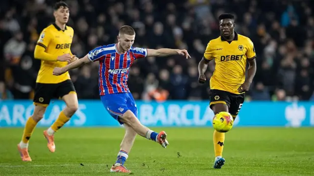 Adam Wharton kicking a ball 