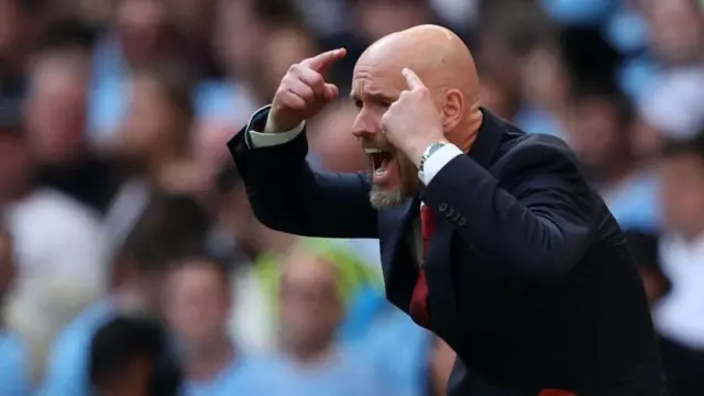 Erik ten Hag gesturing to his team