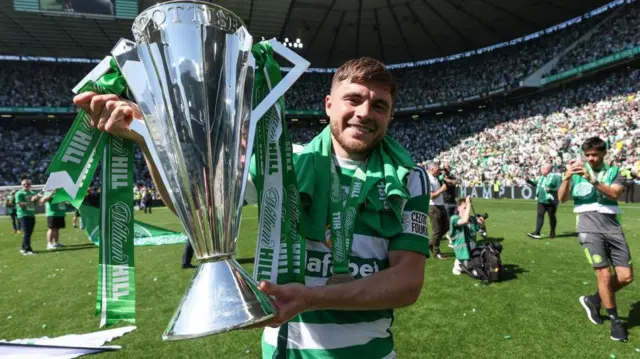 Celtic's James Forrest with the Scottish Premiership trophy