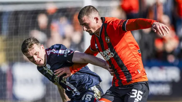 Dundee's Ethan Hamilton and Dundee United's Max Watters