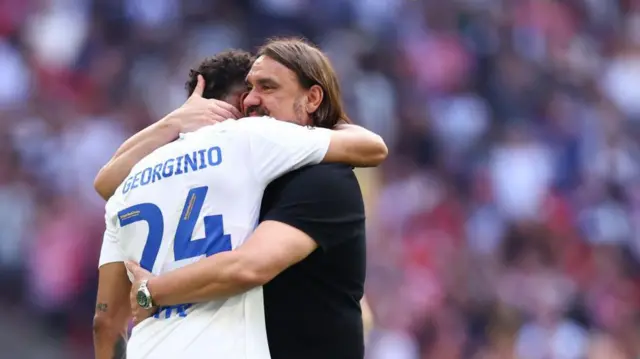 Daniel Farke hugs Georginio Rutter 