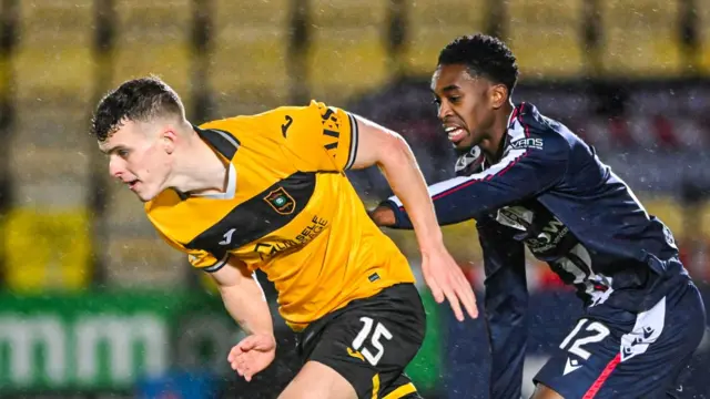 Livingston's Lewis Smith and Dundee's Imari Samuels