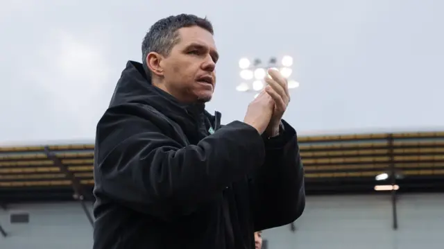 Manchester United manager Marc Skinner applauds