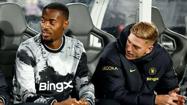 Tosin Adarabioyo and Liam Delap of Chelsea chat on the bench