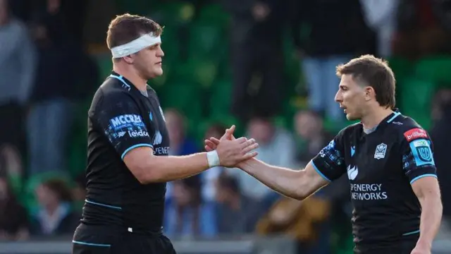 Scott Cummings and Sebastian Cancelliere shake hands