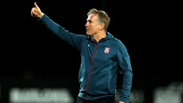 Phil Parkinson waves to Wrexham fans