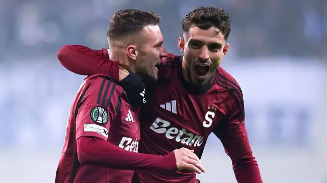 Albion Rrahmani of AC Sparta Praha (R) celebrates scoring his team's first goal with teammate Lukas Haraslin (L) during the UEFA Conference League 2025/26 League Phase MD5 match between Universitatea Craiova and AC Sparta Praha