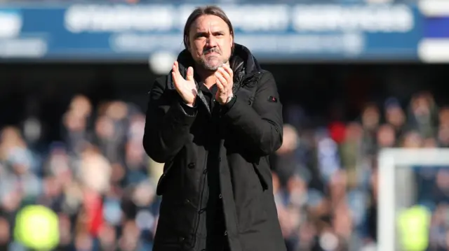 Daniel Farke applauds the travelling Leeds United fans at Loftus Road